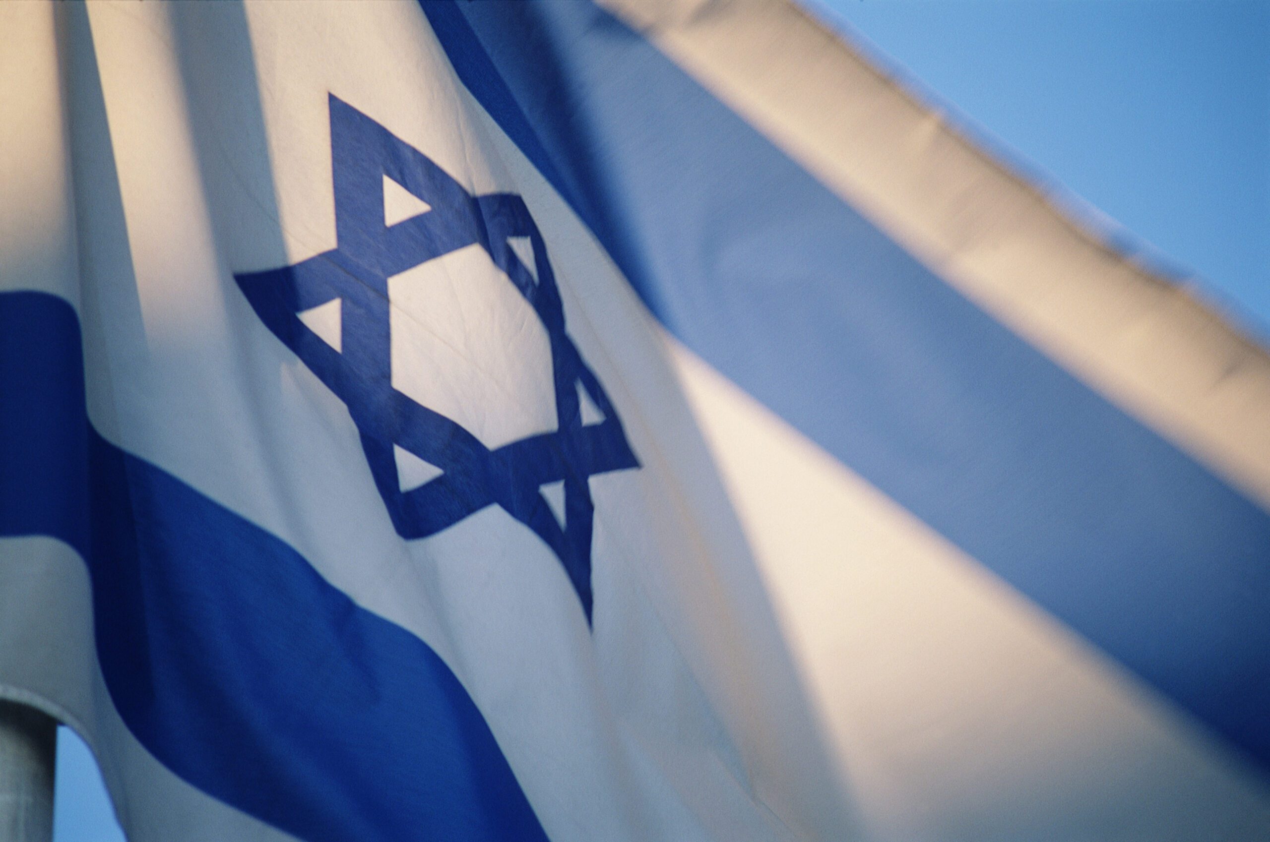 Flag of Israel with Star of David emblem, low angle view